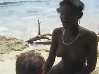 Hairy African babe fuck Euro lad in the Beach